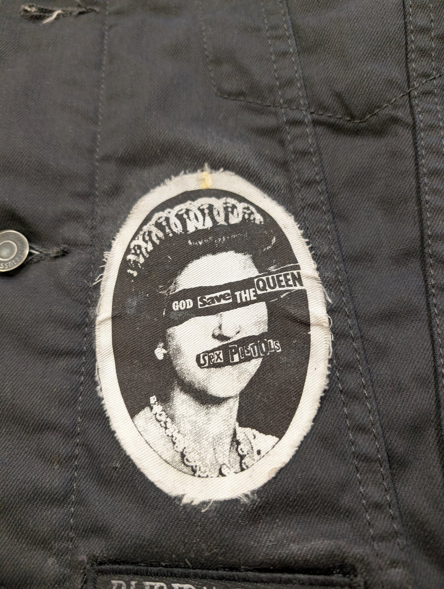 Customised Levi's jacket with band patches