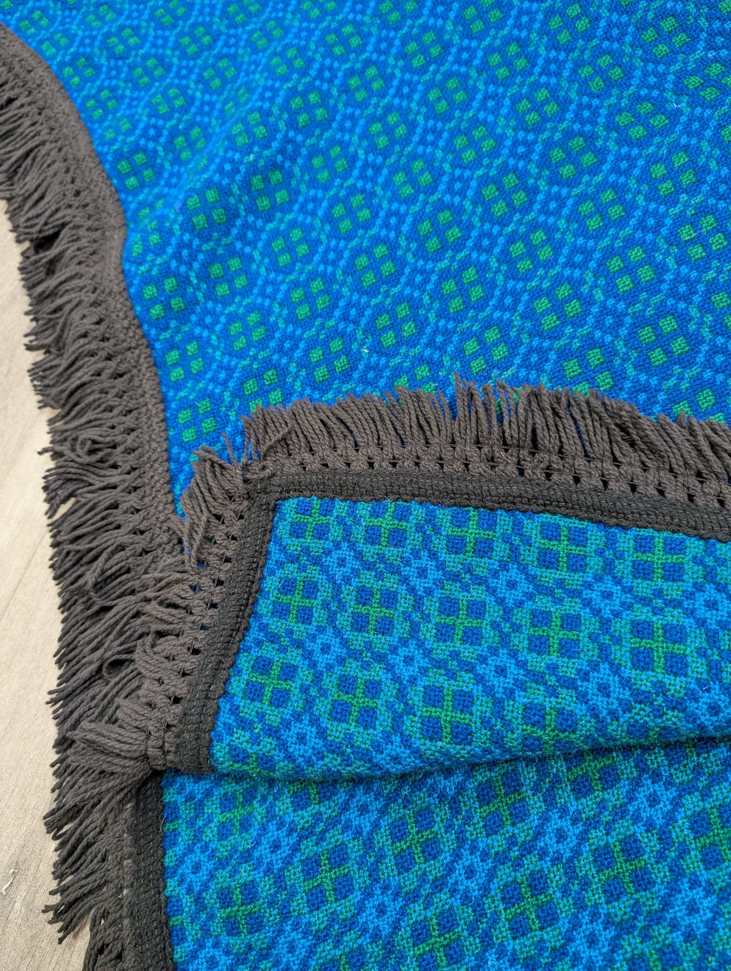 Reversible Welsh tapestry wool fringed poncho