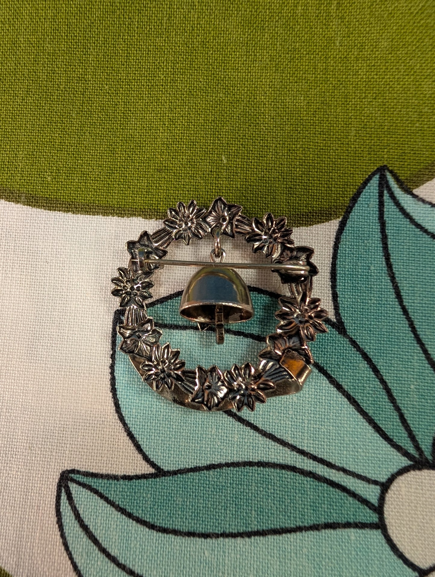 Trümmelbach floral souvenir brooch with bell