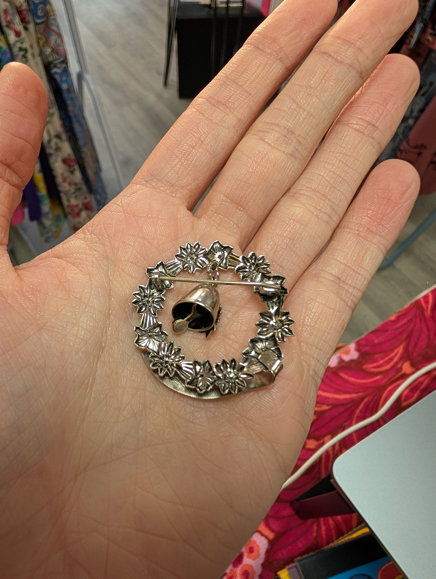 Trümmelbach floral souvenir brooch with bell
